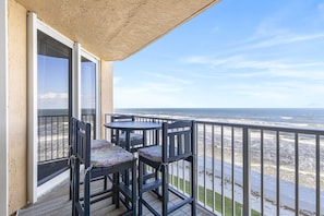 Outdoor dining - Remodeled Oceanfront Condo - Balcony, Beach, Pool (New Smyrna Beach)