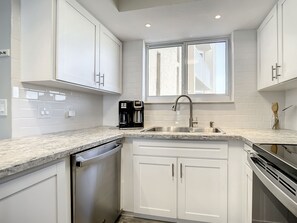 Fridge, microwave, oven, stovetop - Beachfront Condo - OceanFront, Pool & Steps to Flagler Ave (New Smyrna Beach)