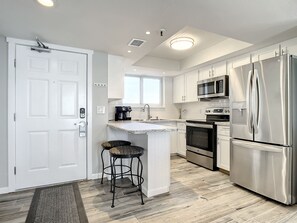 Fridge, microwave, oven, stovetop - Beachfront Condo - OceanFront, Pool & Steps to Flagler Ave (New Smyrna Beach)