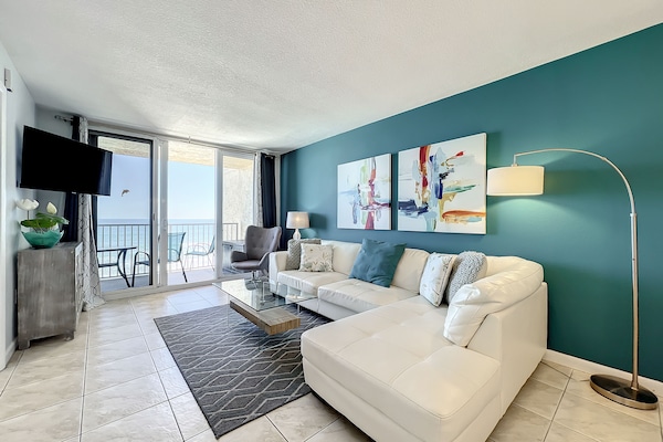 Cozy up with a view! Our living room features a comfortable sectional, ideal for lounging while soaking in the ocean vistas.