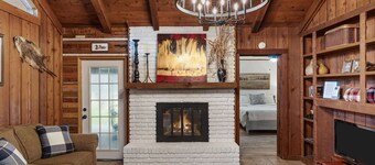 Warm, Rustic Lodge with private dock access steps away, featuring a firepit, outdoor dining, and cornhole for laid-back nights.