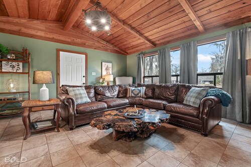 Warm, Rustic Lodge with private dock access steps away, featuring a firepit & picnic table for outdoor dining