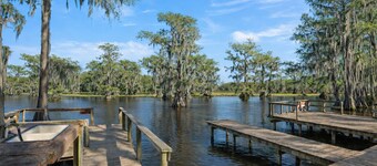 Warm, Rustic Lodge with private dock access steps away, featuring a firepit & picnic table for outdoor dining