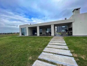 Stylish single-story building with a flat roof and large glass windows.
