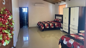 A bedroom with a bed, wardrobe, and a door marked with the number 3. - Hacienda Teofila (Partido)