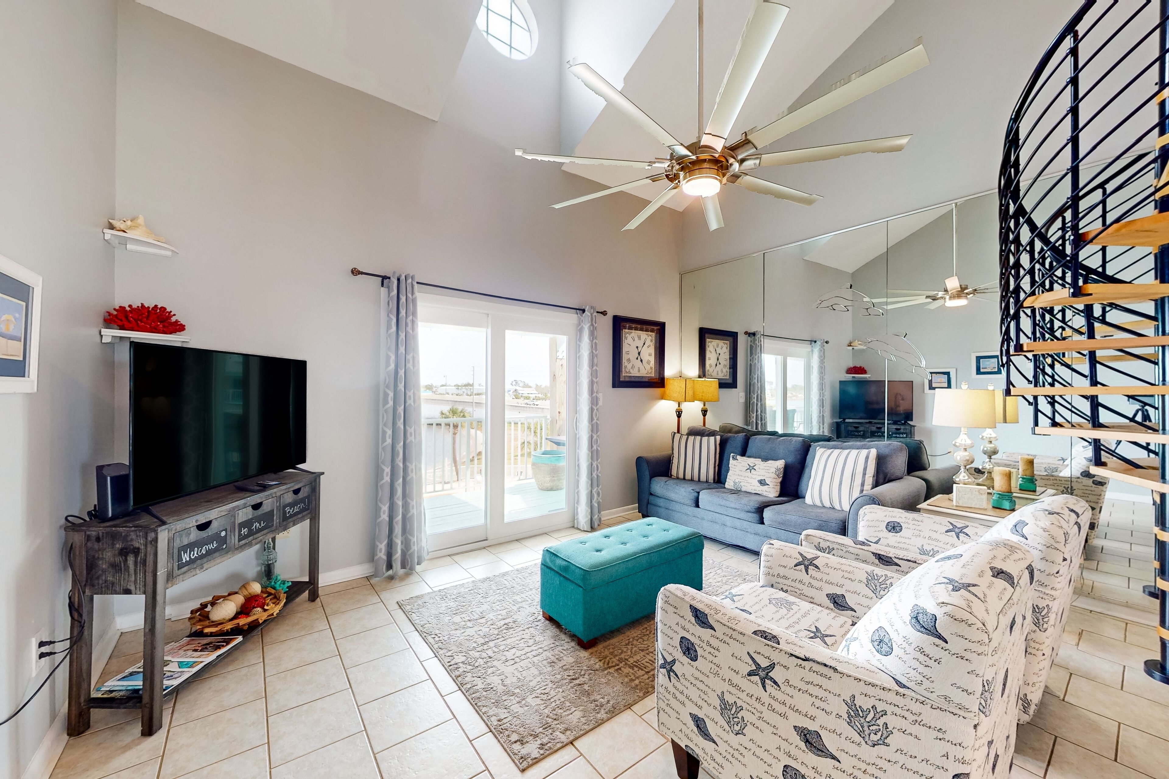 Water-view condo with on-site pool, balcony, & AC