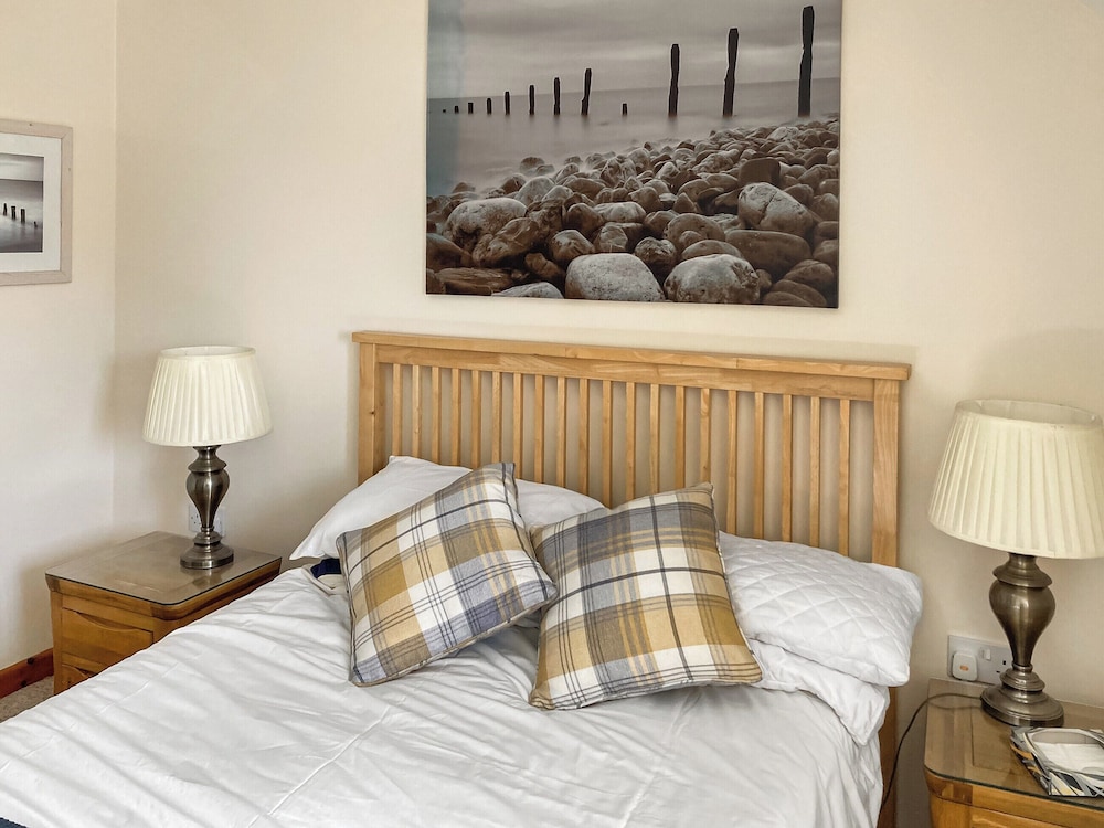 A spacious threebedroom, beach front, first floor apartment with