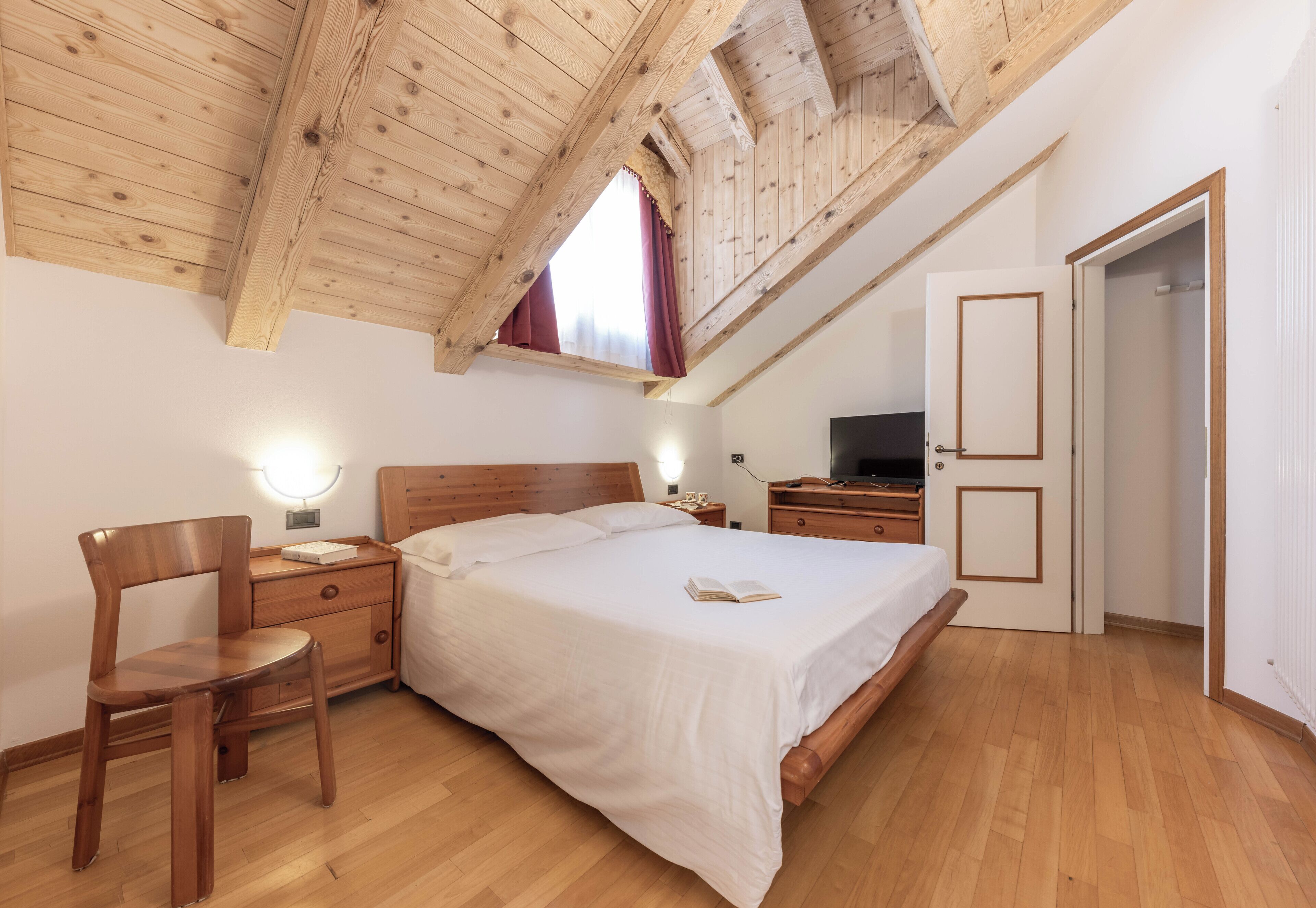 Family Quadruple Room | Minibar, in-room safe, desk, laptop workspace