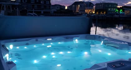 Cozy waterfront boaters dream on private lagoon with hot tub.