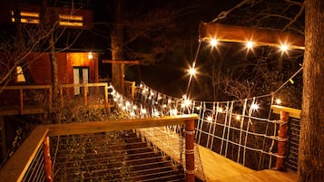 Walk across the rope suspension bridge to the entrance of this serene retreat.