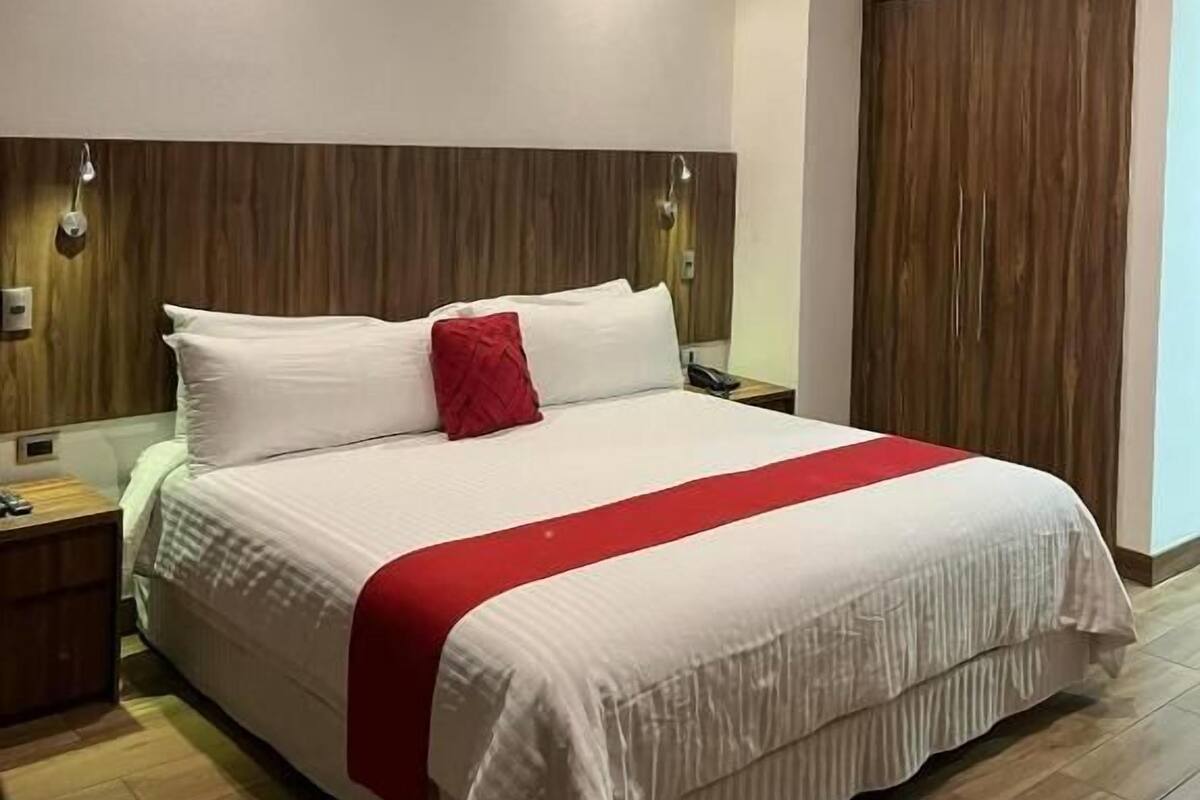 Premium bedding, desk, laptop workspace, soundproofing