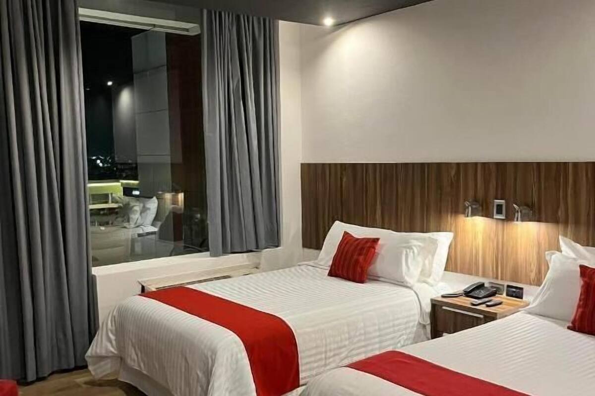 Premium bedding, desk, laptop workspace, soundproofing