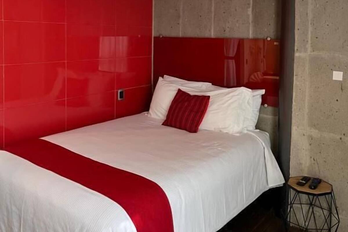 Premium bedding, desk, laptop workspace, soundproofing