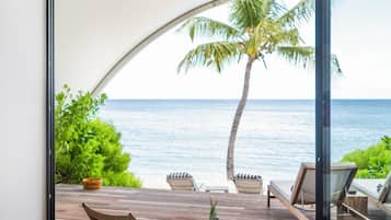 Junior Suite, Beachfront | Desk, laptop workspace, iron/ironing board, cribs/infant beds