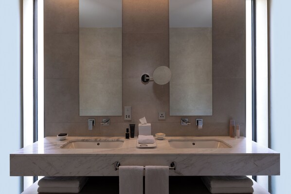 A modern bathroom with two sinks, a large mirror, and a towel rack. - Silversands Beach House Adult only (St. George's)