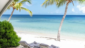 Junior Suite, Beachfront | Desk, laptop workspace, iron/ironing board, cribs/infant beds