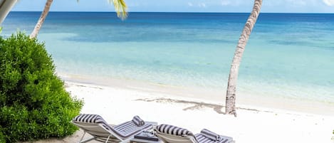 Junior Suite, Beachfront | Desk, laptop workspace, iron/ironing board, cribs/infant beds