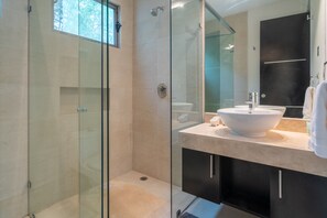 Deluxe Condo | Bathroom | Hair dryer, towels