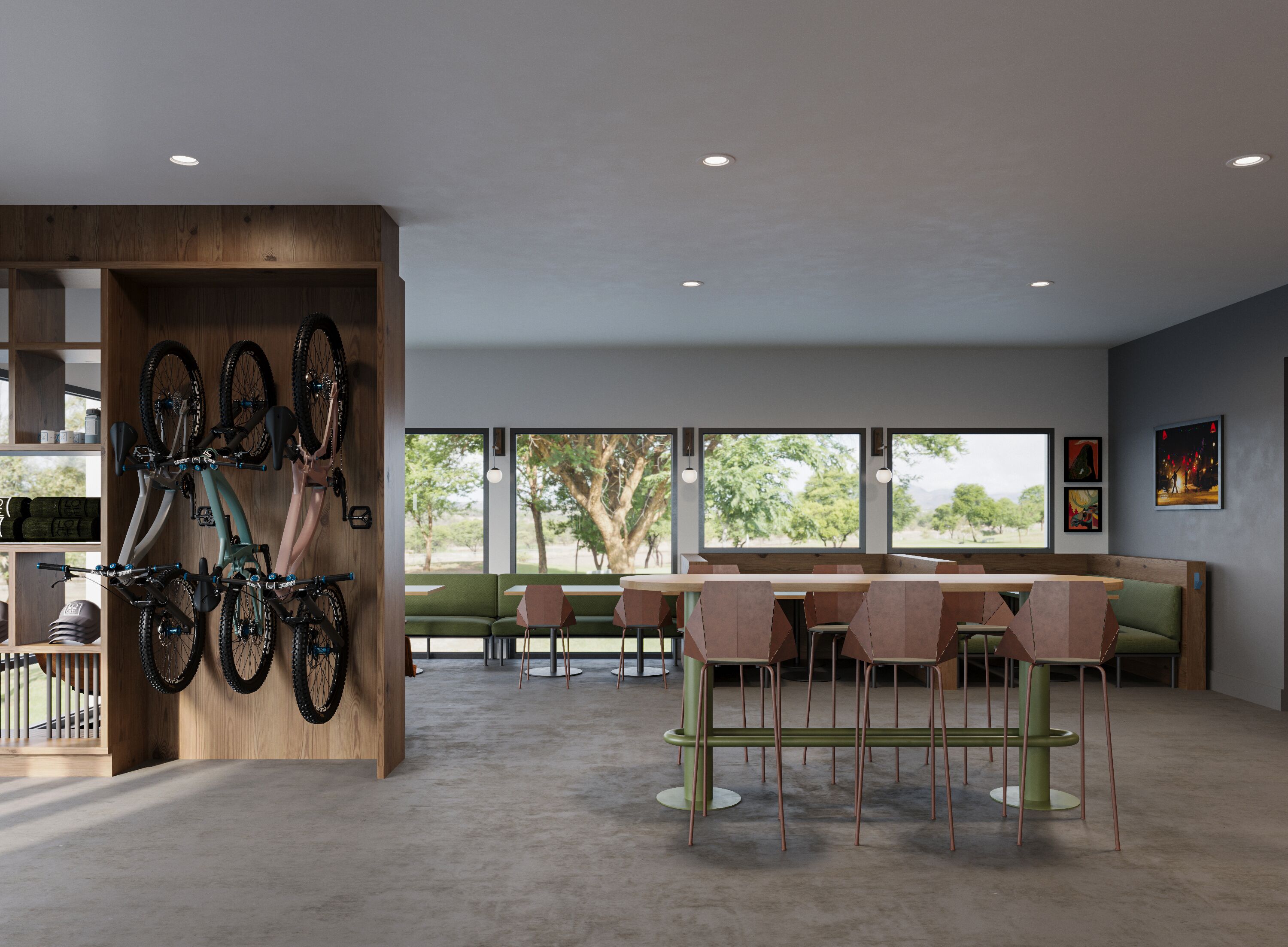 Ein modernes Interieur mit einem Fahrradständer aus Holz, grünen Sitzgelegenheiten und großen Fenstern mit Blick auf Bäume und Berge.
