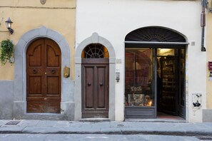 A building with three distinct entrances, each with a different architectural style.