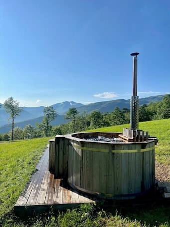 Outdoor spa tub. Apartment "Serrino 2" with Mountain View, Shared Pool & Wi-Fi
