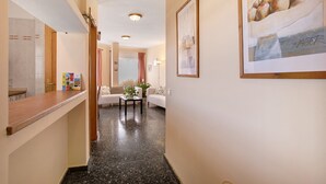 A hotel lobby with a reception desk, a seating area with a sofa and a coffee table, and a framed artwork on the wall. - Vacation Home 'Casa  Fefa' with Sea View and Private Terrace (Candelaria)