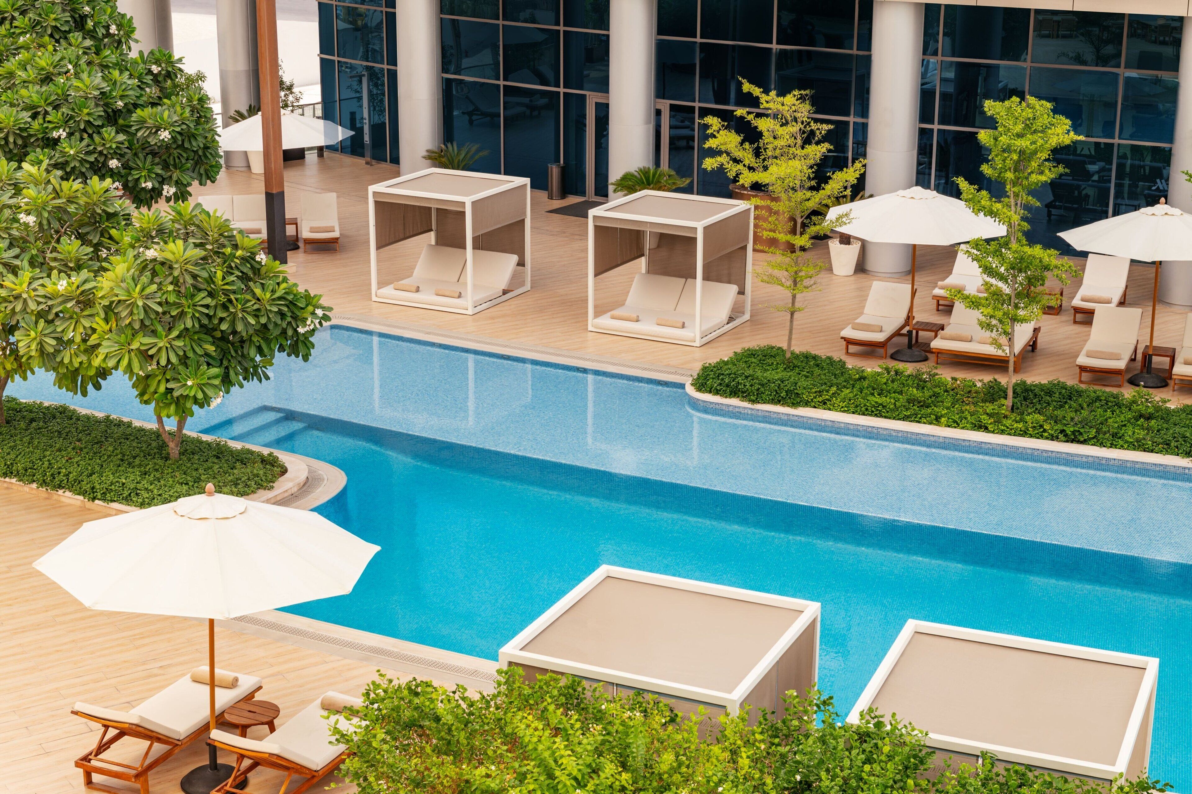 Outdoor pool, open 7:00 AM to 7:00 PM, pool umbrellas, sun loungers