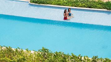 Outdoor pool, open 7:00 AM to 7:00 PM, pool umbrellas, sun loungers