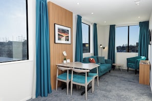One Bedroom Apartment | Living area | 42-inch Smart TV with digital channels
