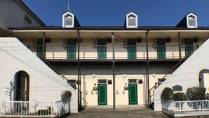 A two-story building with a flat roof, green doors, and a central staircase. - Best room in Kawagoe (Kawagoe)