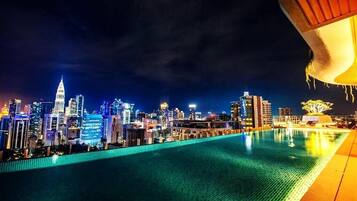 Outdoor pool, open 8:00 AM to midnight, pool loungers