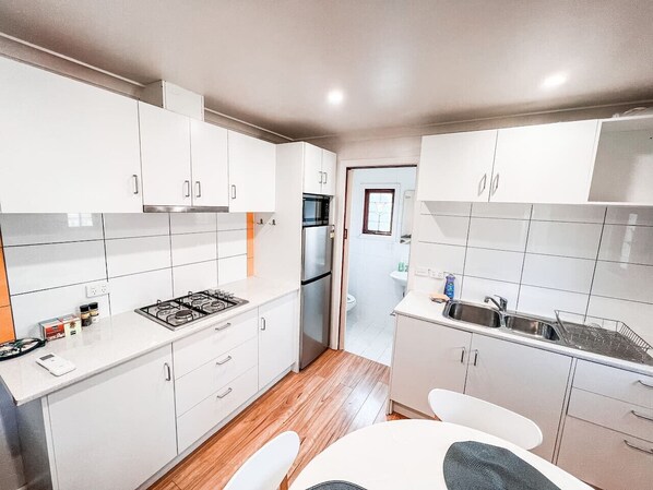 Fridge, coffee/tea maker, cookware/dishes/utensils