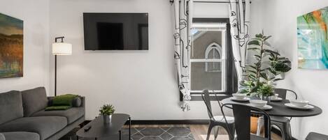 Smart TV, fireplace, books, offices