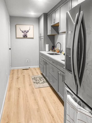 Fridge, coffee/tea maker, cookware/dishes/utensils