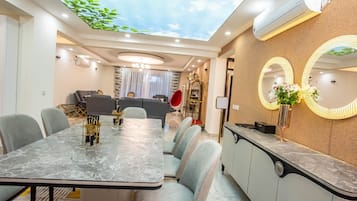 Family Apartment | Living area | 24-inch Smart TV with satellite channels