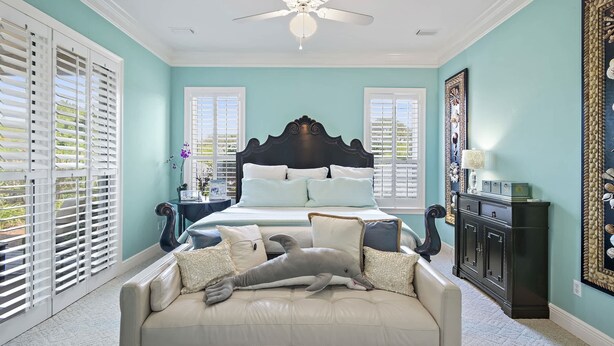 A bedroom with a bed, a ceiling fan, a nightstand, a dresser, and a window with shutters. - Golf Cart & 4 Bikes! 3 Min Walk to Pool & Hot Tub! 8 Min to Beach! New Listing! ~ Sunshine Retreat at Destiny West (Destin)