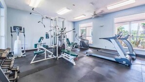 A gym with exercise equipment, a treadmill, and large windows. - Golf Cart & 4 Bikes! 3 Min Walk to Pool & Hot Tub! 8 Min to Beach! New Listing! ~ Sunshine Retreat at Destiny West (Destin)
