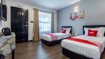 Desk, laptop workspace, free WiFi, bed sheets