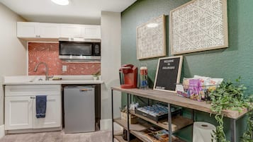 Fridge, microwave, coffee/tea maker, cookware/dishes/utensils