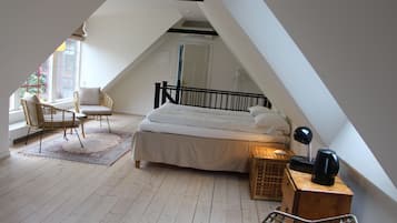 Habitació quàdruple Deluxe | 1 dormitori, roba de llit d'alta qualitat i un bressol de viatge