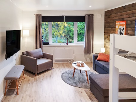 Comfort Apartment | Living area | Flat-screen TV, heated floors. Bryggerihusen