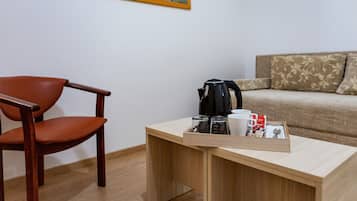 Standard Suite | Living area | 40-inch LCD TV with cable channels