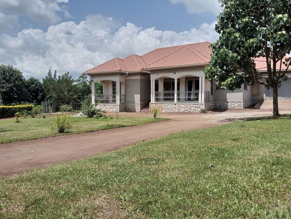 Exterior - Out of town bungalow with a large green compound, trees and outdoor space (Mukono)