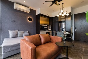 Deluxe Apartment | Living area | 50-inch flat-screen TV with premium channels - KLCC Modern Musical Sty 5Pax Scarletz Suite (Kuala Lumpur)