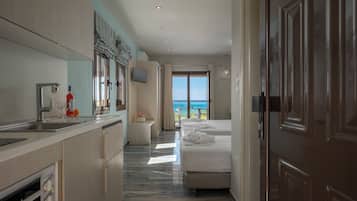 Comfort Room, Sea View | Living area | 32-inch LED TV with satellite channels