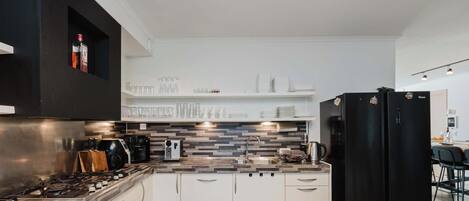 Coffee/tea maker, fridge, microwave, oven