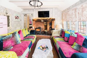 Smart TV, fireplace, books