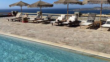 Seasonal outdoor pool, pool umbrellas, sun loungers