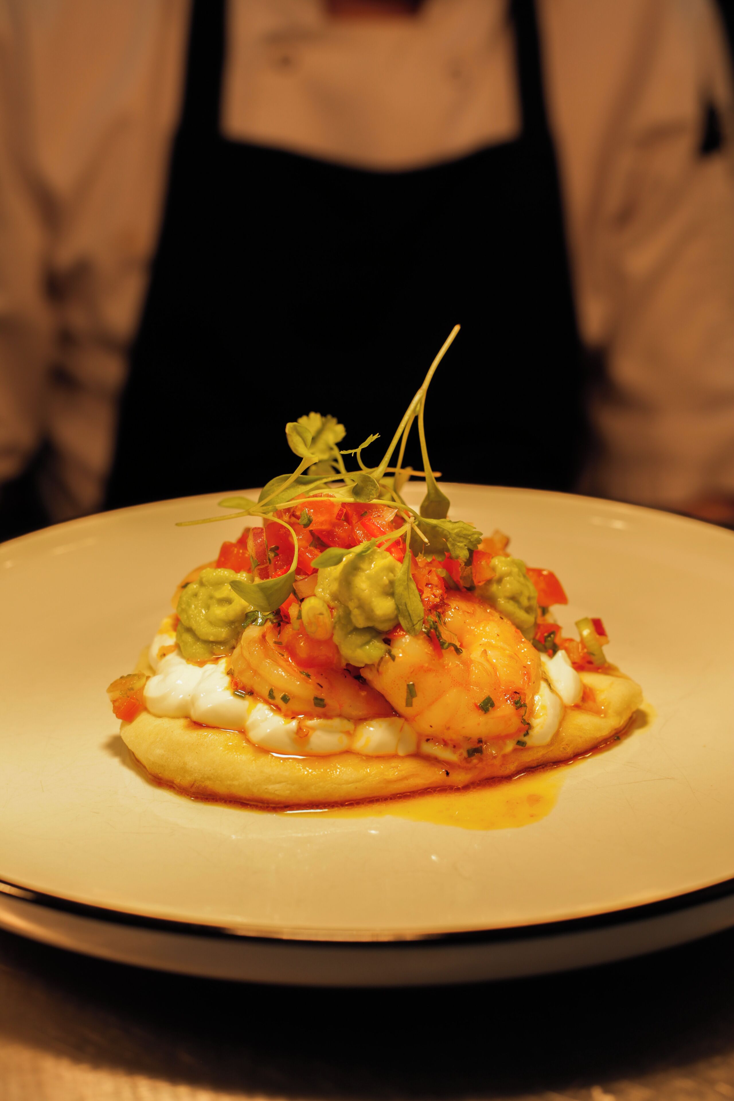 A plate of food with a garnish on top.