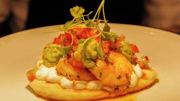 A plate of food with a garnish on top.
